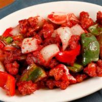 Sweet and Sour Pork · Tender chunks of lean pork deep-fried in batter and quickly tossed with onions and bell pepp...