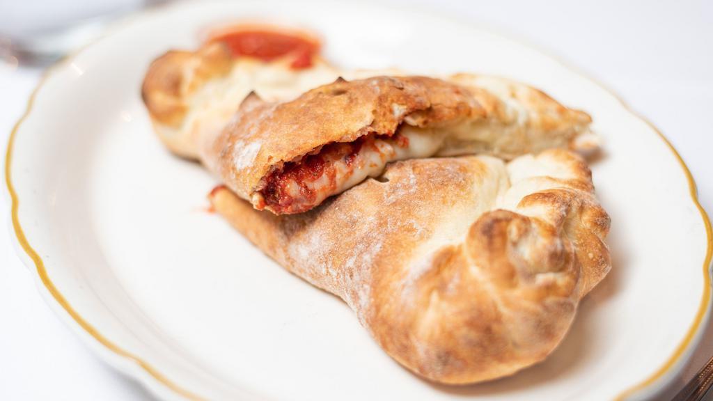 Meat Calzone · Salami, pepperoni, ham, sausage and beef. Served with mayo, mustard, lettuce, tomato and onion.