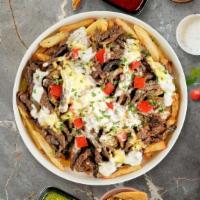 Philly Loaded Fries · Steak, caramelized onions, bell peppers, and melted cheese topped on Idaho potato fries.