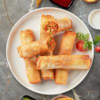 Vegetable Spring Roll · Seasonal vegetables wrapped in rice wrapper and fried until golden crisp. Served with dippin...