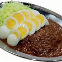 Sliced Egg Curry · Two Rows Of Sliced ,Hard boiled egg