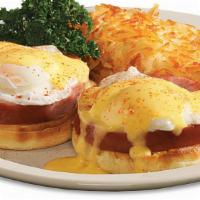Classic Eggs* Benedict · Two farm-fresh poached eggs* and country-sliced ham set atop an English muffin with creamy h...