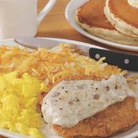 Country Fried Steak & Eggs* · A Southern treat! Two pieces of crispy country fried steak smothered in our savory sausage g...