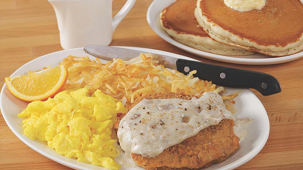 Country Fried Steak & Eggs* · A Southern treat! Two pieces of crispy country fried steak smothered in our savory sausage gravy, with two farm-fresh eggs* and choice of two breakfast sides.