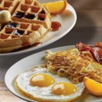 Belgian Waffle Combo · A crisp Belgian waffle served with two eggs* and choice of breakfast meat. Includes syrup.