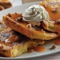 Cinnamon Roll French Toast · Three slices of sweet cinnamon roll dipped in egg batter and griddled to perfection. Lightly...