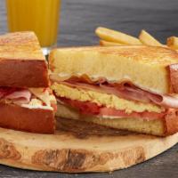 The Shari'S Classic · Creamy scrambled eggs*, bacon, grilled ham, grilled tomato, choice of cheese and mayo on gri...