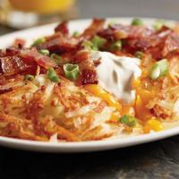 Side Of Stuffed Hash Browns · Our crispy hash browns are stuffed with sour cream and cheddar cheese then topped with crisp...