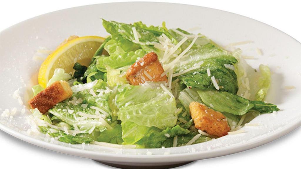 Caesar Salad · Romaine lettuce tossed in our delicious Caesar dressing, tossed with Parmesan cheese and crunchy croutons.