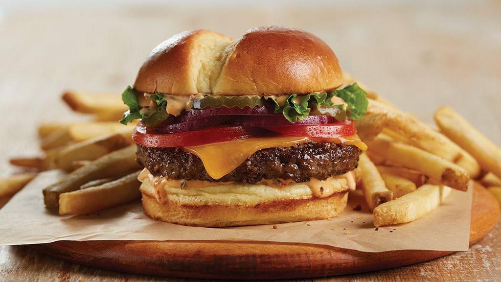 Tillamook® Cheddar Burger · Simple and delicious with lettuce, tomatoes, red onions, pickles and Shari’s special sauce. Served with choice of side.