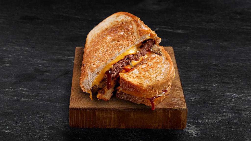 Sourdough Patty Melt · Tillamook® cheddar, caramelized onions, Shari’s special sauce on sourdough bread. Served with choice of side.