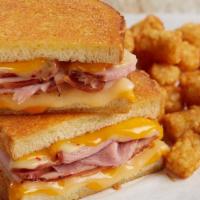 Grilled Ham & Four-Cheese Melt · Tillamook® cheddar, pepper jack and Swiss layered with tender, hand-carved ham on thick-cut ...