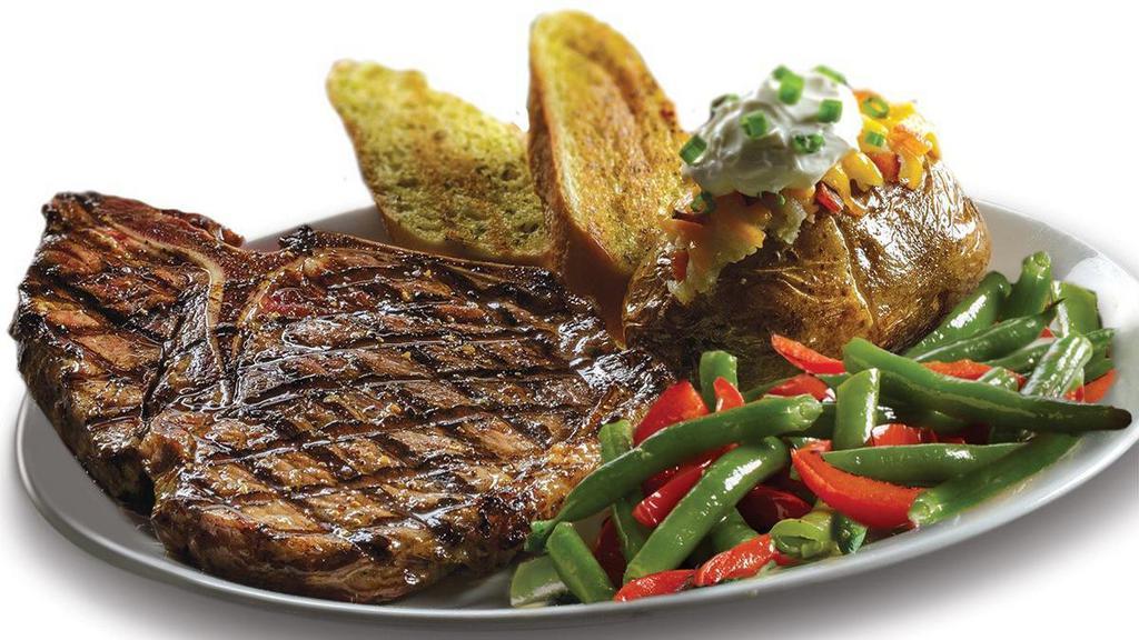 T-Bone Steak* · This 16oz impressive cut of beef* is considered among the highest-quality steaks, containing both the short loin and tenderloin. Served with choice of two sides and a dinner roll.
