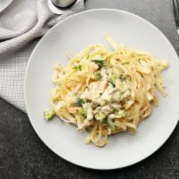 The Fettuccine Chicken · Fresh fettuccine pasta with grilled chicken, mushrooms, garlic, tomatoes, parmesan cheese, a...