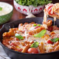 The Baked Penne · Tender penne pasta tossed in a rich and delicious marinara sauce with creamy melted cheese.