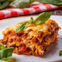 Meat Lasagna · Mouthwatering pasta dish made with layers of Meat, lasagna noodles, mozzarella cheese, parme...