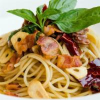 The Spaghetti Aglio E Olio · Sliced galic, parmesan cheese, olive oil, black pepper, and your choice of sauce on a bed of...