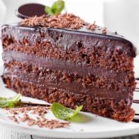 The Chocolate Cake · Our signature rich, dark belgian chocolate cake.