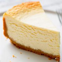 The Cheesecake · A rich and creamy New York style cheesecake baked inside a honey-graham crust.