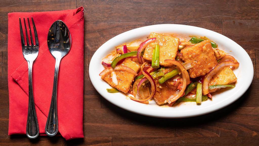 Pan Fried Chilli Tofu · Signature dishes. Spicy level 1. Tofu, scallions, red and green peppers, and chilli paste.