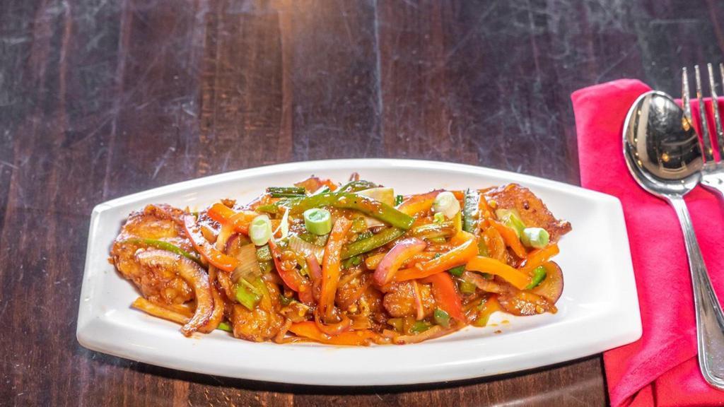 Pan Fried Chilli Fish · Signature dishes. Spicy level 1. Onion, red and green pepper, scallion, and chilli paste.