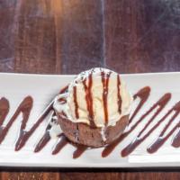 Warm Chocolate Lava Cake · Signature dishes. Chocolate cake with a molten center, served a la mode.