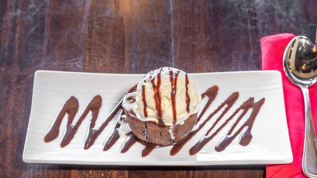 Warm Chocolate Lava Cake · Signature dishes. Chocolate cake with a molten center, served a la mode.