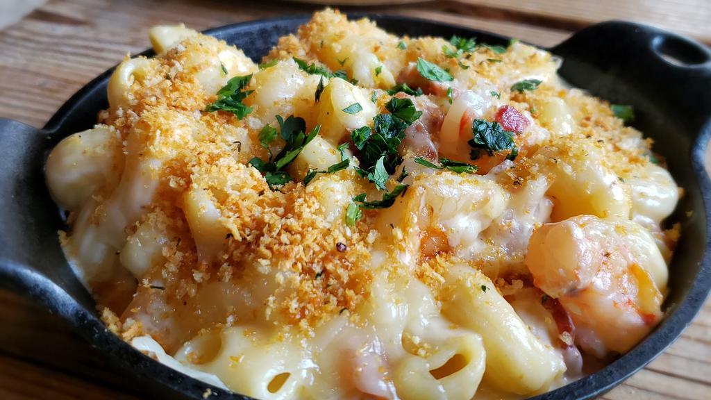 Surf'N Turf Mac · Prawns and bacon mixed into our classic 4-cheese blend of mac, topped with truffle oil. Indulge.