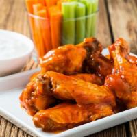 Spicy Buffalo Bone-in Chicken Wings · Fresh wings crisp to perfection tossed in tangy buffalo sauce.