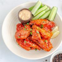 Sweet Chili Chicken Wings · Exquisite sweet and chili sauce smothered on fresh batch of chicken wings.