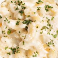 White Truffle Mac & Cheese · with Truffle Oil and a blend of Cheddar, Parmesan, and Gruyere Cheeses