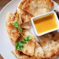 Roti With Yellow Curry · (Vegan) Indian roti bread served with yellow curry