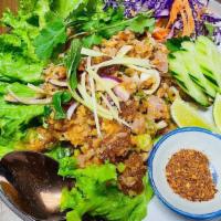Nam Khao Lettuce Wraps · Crispy rice salad, Lao-style fermented pork sausage, peanuts, scallions, shallots, mint, cil...