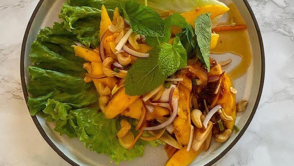 Mango Salad · Fresh mango, red onion, scallions, carrots, cashew nuts, mild Thai chili paste Edamame Tometoe