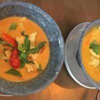 Red Curry with Chicken · (Gluten-Free) Choice of protein simmered in coconut milk, red curry, bamboo shoots, Thai bas...