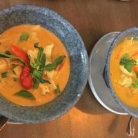 Red Curry with Pork · (Gluten-Free) Choice of protein simmered in coconut milk, red curry, bamboo shoots, Thai bas...