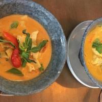 Red Curry with Beef · (Gluten-Free) Choice of protein simmered in coconut milk, red curry, bamboo shoots, Thai bas...