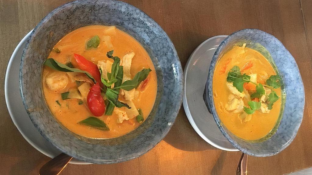 Red Curry with Beef · (Gluten-Free) Choice of protein simmered in coconut milk, red curry, bamboo shoots, Thai basil, and zucchini