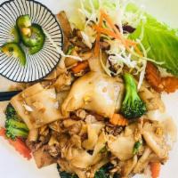 Pad See Ew with Tofu · Wok-fried rice noodles sautéed with egg, broccoli, garlic, vinegar, coconut sugar, and soy s...