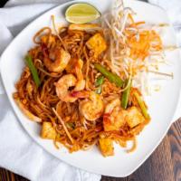 Pad Thai · Pan - fried thin rice noodles with your choice of chicken or shrimps with egg, tofu, bean sp...