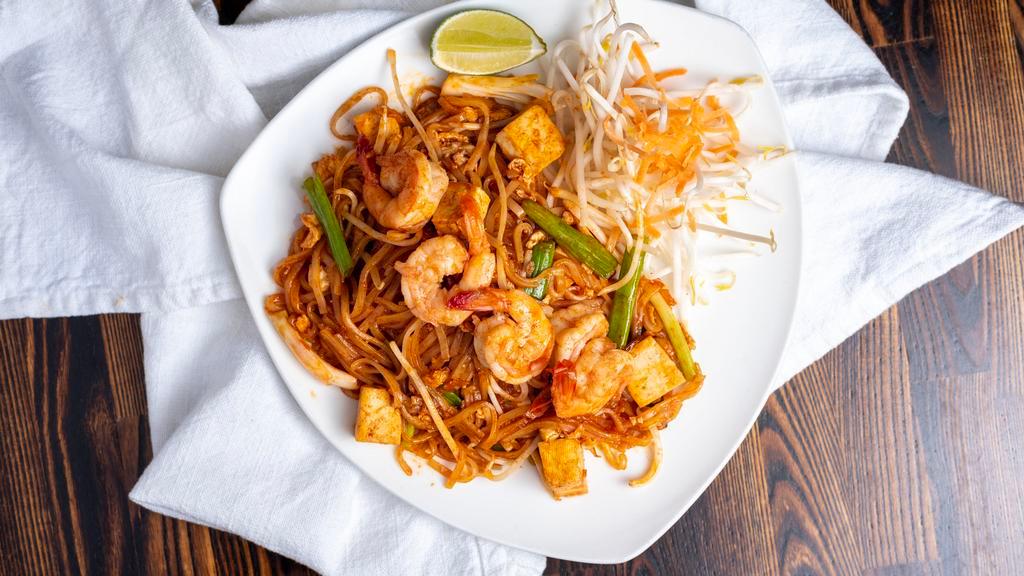 Pad Thai · Pan – fried thin rice noodle with your choice of chicken or shrimp, egg, tofu, bean sprout, green onions and ground peanut.