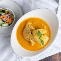 Yellow Curry Chicken · Boneless skinless chicken thigh with potato cubes served with cucumber salad.