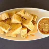 Crispy Tofu · Fried tofu served with sweet and sour sauce topped with ground peanut.