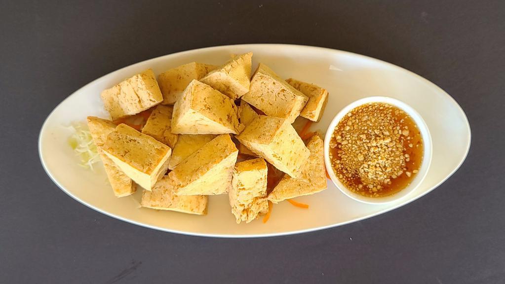 Crispy Tofu · Fried tofu served with sweet and sour sauce topped with ground peanut.