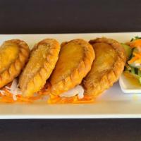 Chicken Curry Puff · Deep - fried curry puff stuffed with chicken, potatoes, onion and carrot served with cucumbe...