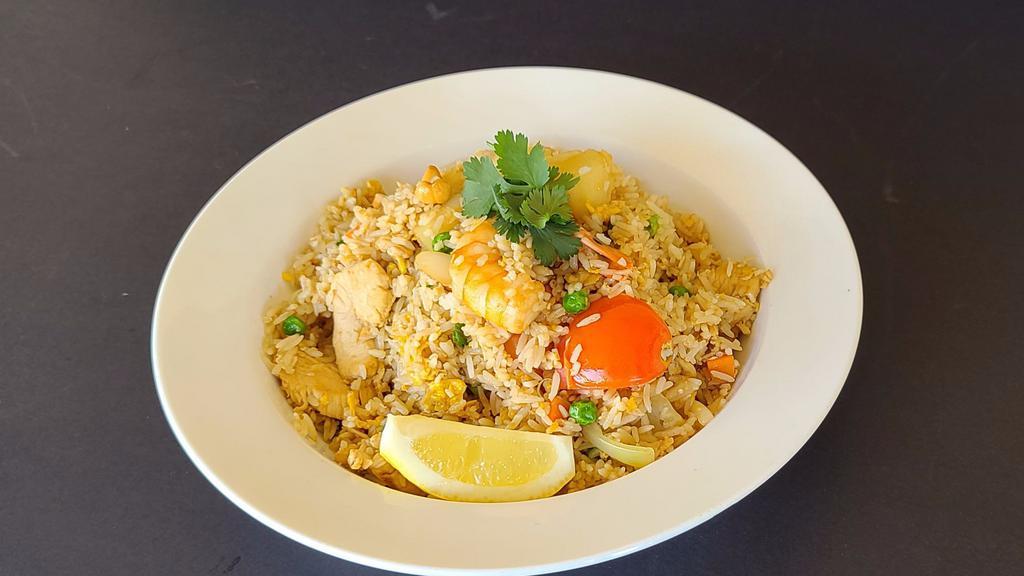 Pineapple Fried Rice · Pan – fried rice, chicken, pork, shrimp, pineapple chunk, egg, cashew nuts, onions, tomatoes and green onion.