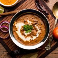 Dal Makhani (DM) · Black lentils cooked with herbs and spices, then sautéed in butter and garnished with fresh ...