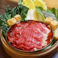 Signature Mala Spicy Hot Pot Set · Serves 2: Includes wagyu beef, lamb, pork belly, prawns, puff tofu, 1x garden green, 2x rame...