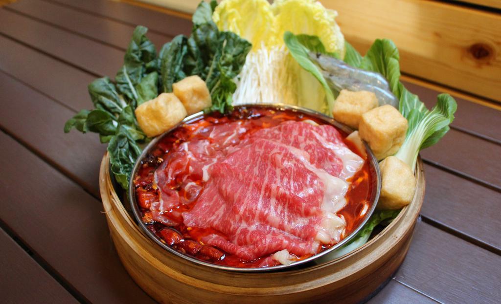 Signature Mala Spicy Hot Pot Set · Serves 2: Includes wagyu beef, lamb, pork belly, prawns, puff tofu, 1x garden green, 2x ramen noodle, 1x sauce set.