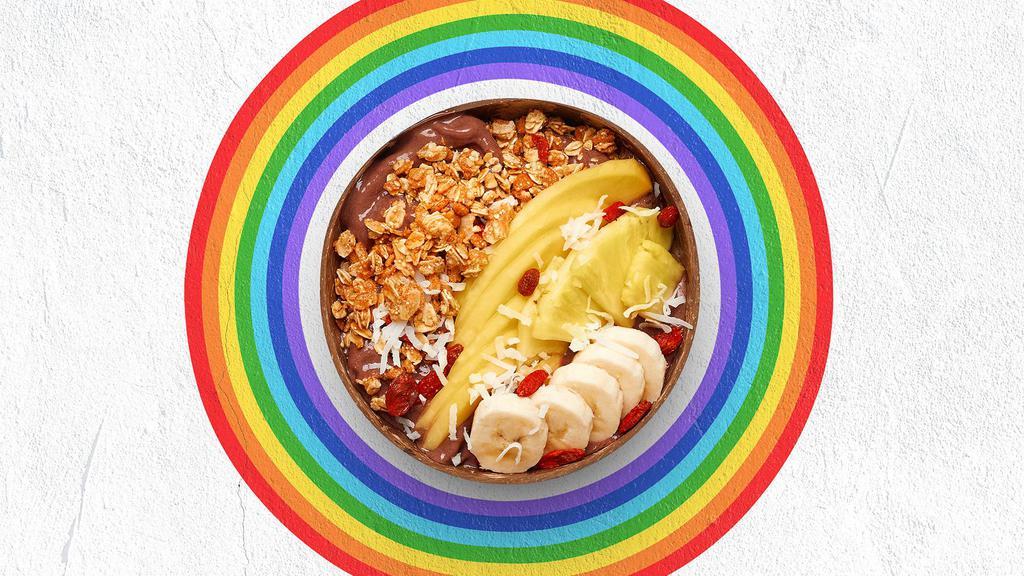 Beach Babe Acai Bowl · Acai bowl topped with granola, bananas, pineapple, mango, shredded coconut, and honey.